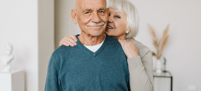 A senior couple smiling for the photo because they have found good interstate moving companies